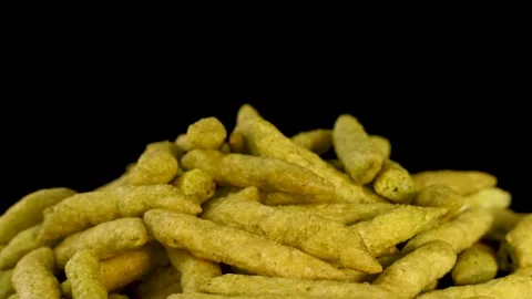 Slow Zoom on Crispy Green Pea Puff Snack Pile 库存影片 319981642