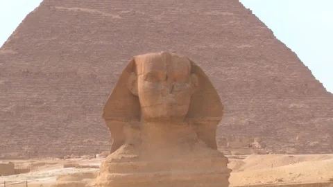 Slow Zoom of The Great Sphinx of Giza With Pyramid in the Background Stock Footage