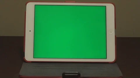 Slow zoom in on ipad with chroma key green screen Stock Footage 79503877