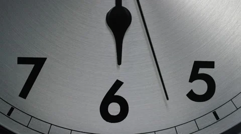 Slow zoom in to the number 6 of a clock face as the seconds hand ticks by Stock Footage 60826367