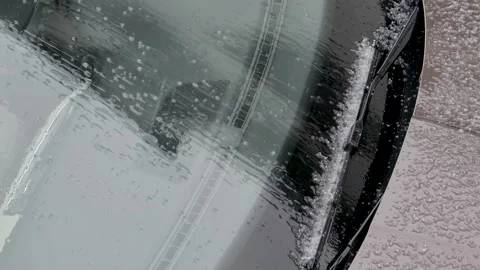 Slow zoom-out from car covered with tiny hail during heavy rain bad weather in Stock Footage 168409834
