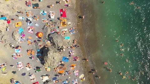 Slow Zoom Out High Angle Aerial View Of Sea Beach With Swimming People Video stock 117232402