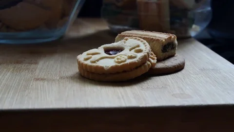 Slow zoom in on a stack of 3 biscuits on wooden surface. Stock Footage 98972125