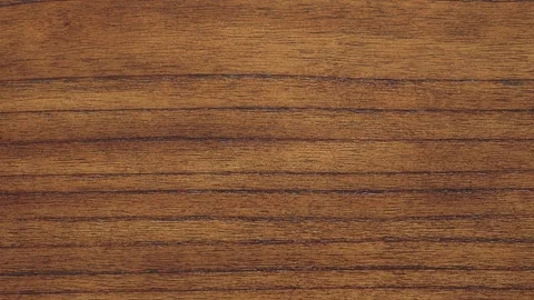 Slow zoom-in top-down on detailed wood grain of polished table Video stock 313628928