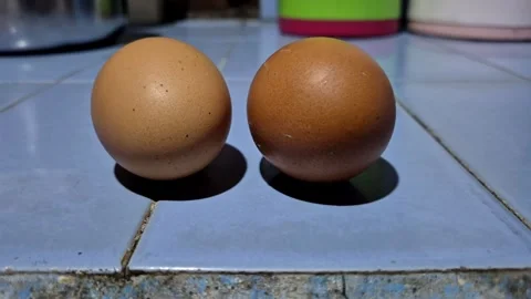 Slow zoom in of two brown chicken eggs Stock Footage 337374437