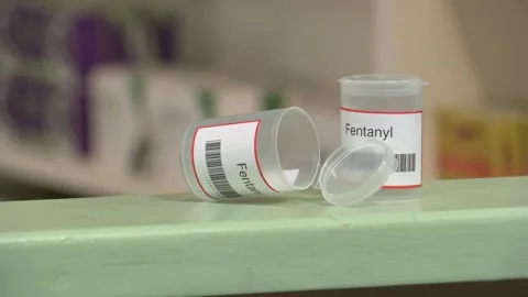 Slow zoom in on two empty fentanyl bottles Stock Footage 288094209