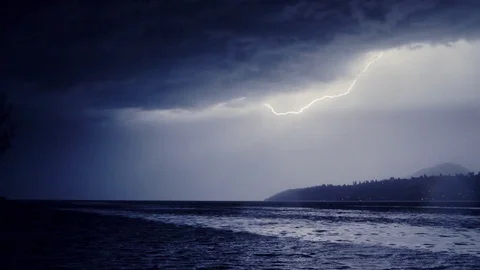 Slowed down 50%: Lightning Illuminates Okanagan Lake at Night, forestFire Risk,  Stock Footage 77357953