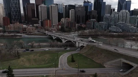 Slowed down Steady aerial shot of the Centre Street Bridge and Bow River Stock Footage 336354910