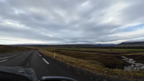 Slowly Advancing Along an Open Icelandic Road Under Cloudy Skies Stock Footage 342269982