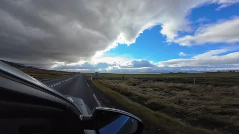 Slowly Advancing Along an Open Icelandic Road Beneath Clouds Video stock 342270978