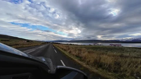 Slowly Advancing Along a Road Beside Icelandic Waters Stock Footage 342270019