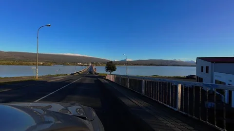 Slowly Advancing Along a Waterside Road in Egilsstaðir, Iceland Stock Footage 342269282
