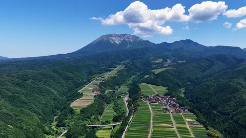 Slowly Advancing Drone View of Mount Daisen and Tottori Farmland Stock Footage 342256137