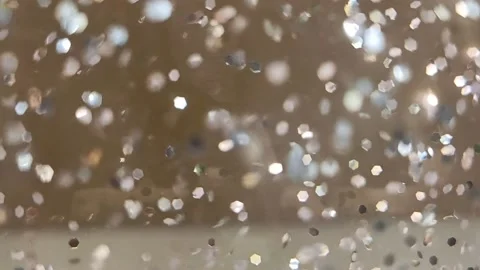 Slowly chaotically moving shiny sparkles on a blurred background Stock Footage 221635660