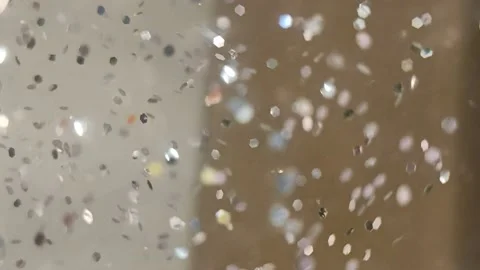 Slowly chaotically moving shiny sparkles on a blurred background Stock Footage 221636339