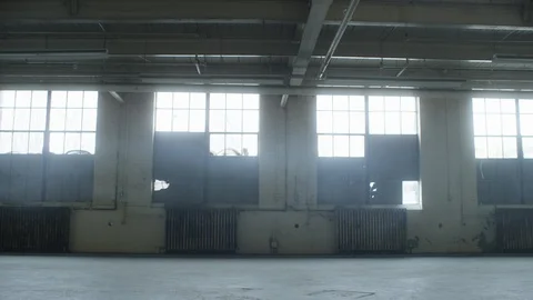 Slowly drifting through door frame in industrial loft warehouse Stock Footage 104432219