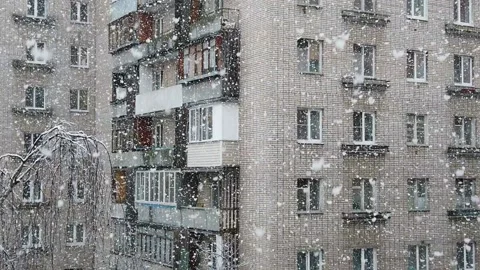 Slowly falling snow in the old town in winter Stock Footage 151518295
