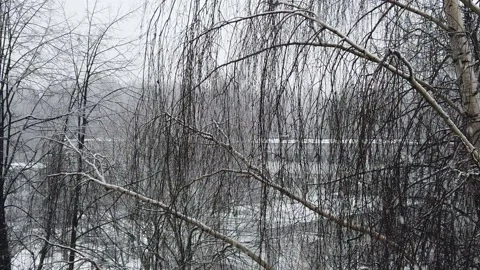 Slowly falling wet snow in the old town in spring. Weather in April. Stock-Footage 151626015