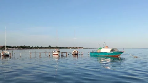 Slowly floating to the dock on a boat in the evening Stock Footage 189824654