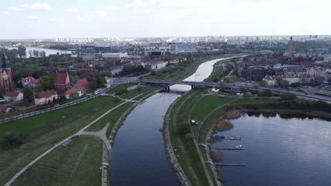 Slowly floating frame from a drone along the river to the bridge Video stock 223423110