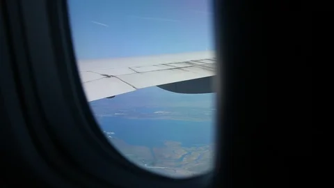 Slowly Looking Out Airplane Window While Flying Stock-Footage 102498865