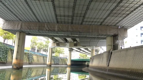 Slowly moving along the river in Tokyo Japan Stock Footage 123075321