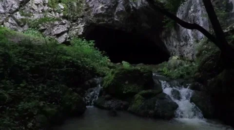 Slowly moving backwards, out of the dark cave. Stock Footage 55728422