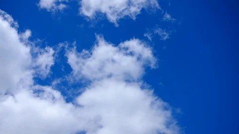 Slowly moving clouds over blue sky video Stock Footage 92077461