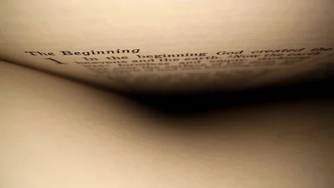 Slowly moving down past first words of the Bible; words on top and blank Stock Footage 128749555