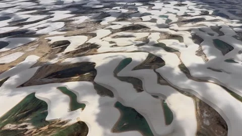 Slowly Moving Over Curving Lagoons and Sand Ridges in Lençóis Maranhenses Video stock 342441197