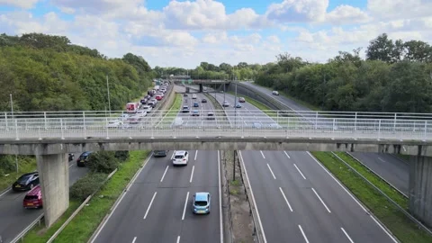 Slowly moving queue of cars at traffic lights on highway exit Video stock 164822026