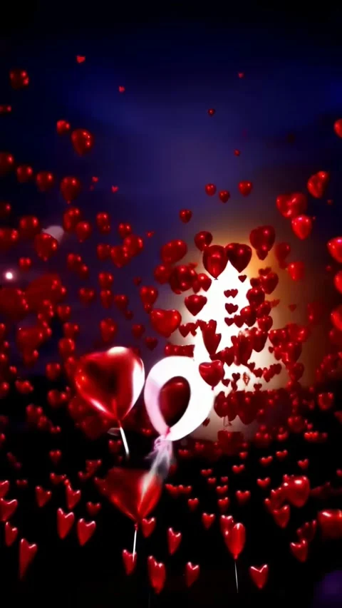 Slowly moving red balloons in the shape of hearts and pink against the nigh.. 動画素材 263798171