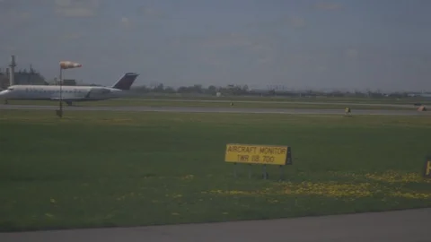 Slowly Moving On Runway Passing Another Plane And Safety Flag Stock Footage 118616212