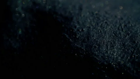 Slowly moving sparkling gray shape as it moves downwards and into shadow. Stock-Footage 217363597