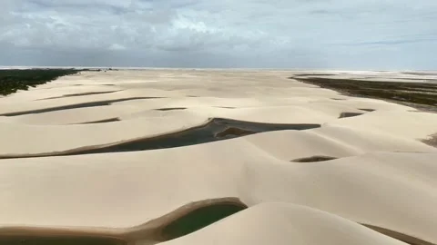 Slowly Moving Toward Dark Lagoon Ribbons Across Lençóis Maranhenses Stock Footage 342441644