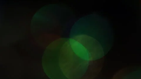 Slowly moving vivid colored lights in the darkness Stock Footage 309871318