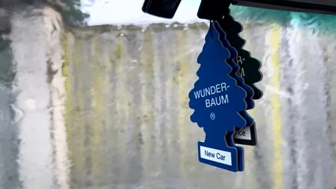 Slowly moving Wunder Baum air fresheners on car interior Stock Footage 245640180