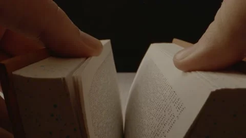 Slowly opening of an old book with a slow push in on the book. Stock Footage 165256751