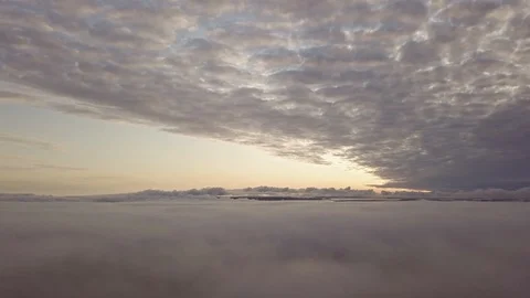 Slowly panning aerial view between layers of fog and clouds Stock Footage 122032145