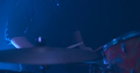 Slowly Panning Down as a Man Plays the Drums Stock Footage 98906124