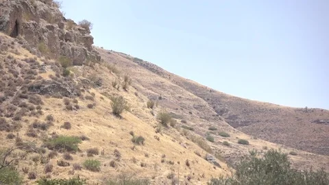 Slowly Panning Down Slopes of Mountainside in Israel Desert Stock Footage 78548289