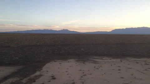 Slowly passing by an open desert plain Stock Footage 335958870