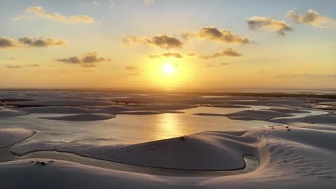 Slowly Revealing Sunset Lagoon Patterns Across Lençóis Maranhenses Stock Footage 342446465