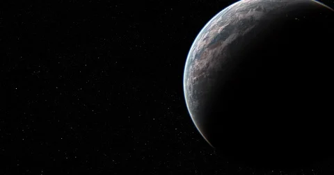 Slowly rotating camera moves past earth, from dark side to sunlit side 動画素材 78367768