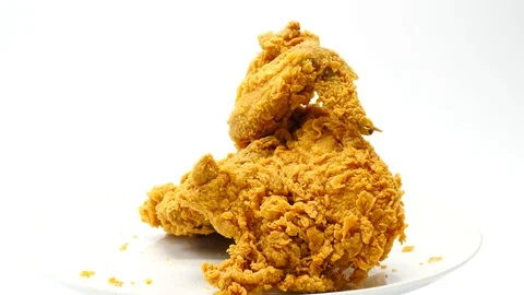 Slowly rotating plate with fried chicken portions Stock Footage 105946005