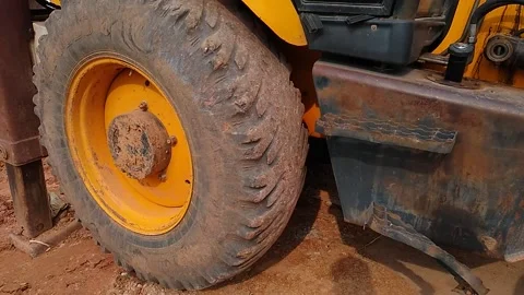 Slowly rotating vehicle tyre, construction equipment Stock Footage 143843845