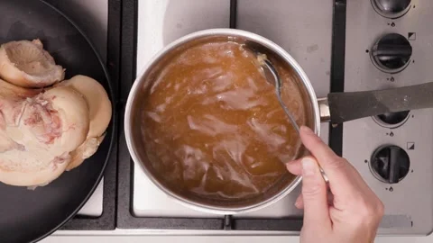 Slowly Simmering Bone Broth: A Rich Home Stock Brought to Life by Hours of Stock Footage 344032097