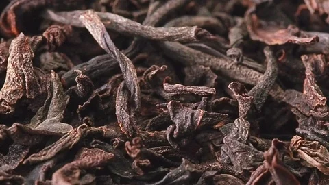 Slowly sliding movement along heap of dried tea leaves, close shot. A lot of Stock Footage 127474512