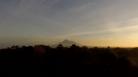 Slowly take off to see the volcano of Merapi in early morning Stock Footage 158813520