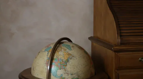 Slowly tilt down and pan right along old colourful globe. HD 1080p 24fps. Stock Footage 22724712